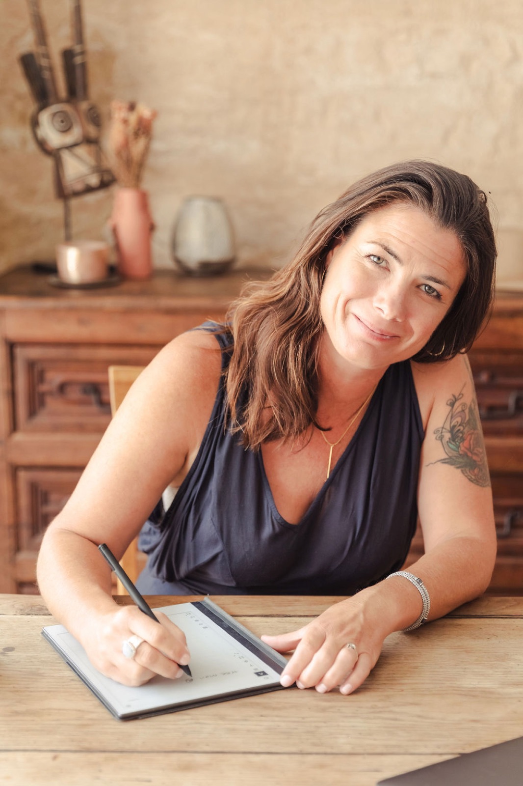 Belinda Henry writing at her desk